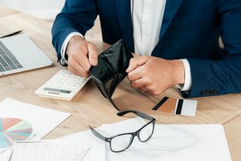 close-up-hands-holding-wallet_23-2148773966